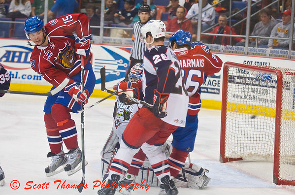 Hamilton Bulldogs forward Adam Pineault (15), on his toes, deflects the puck into the Syracuse Crunch goal. Hamilton Bulldogs forward Adam Pineault (15), on his toes, deflects the puck into the Syracuse Crunch goal.