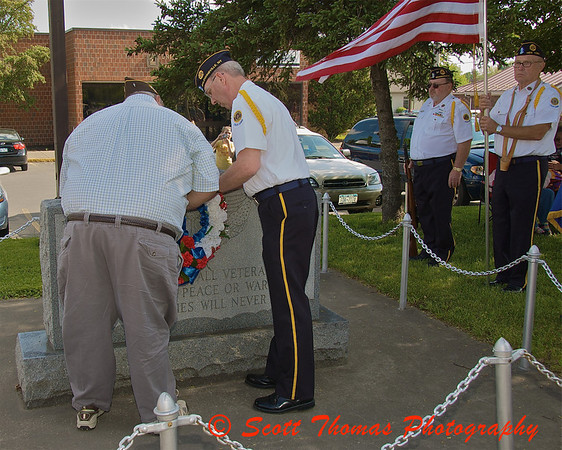 Honoring those who gave their life for our freedom by placing a wreath at the Veteran’s Monument before the start of the Baldwinsville (New York) Memorial Day Parade on Saturday, May 30, 2009. Honoring those who gave their life for our freedom by placing a wreath at the Veteran’s Monument before the start of the Baldwinsville (New York) Memorial Day Parade on Saturday, May 30, 2009.