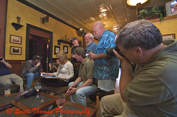 Members of the Syracuse Photographers Association check out a members portfolio at the Mohegan Manor in Baldwinsville, New York.