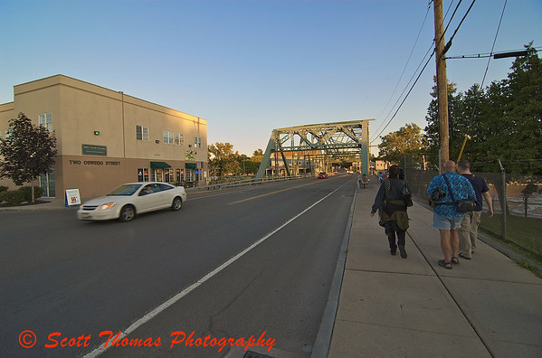 Heading for a sunset, members of the Syracuse Photographers Association walk towards the Seneca River.